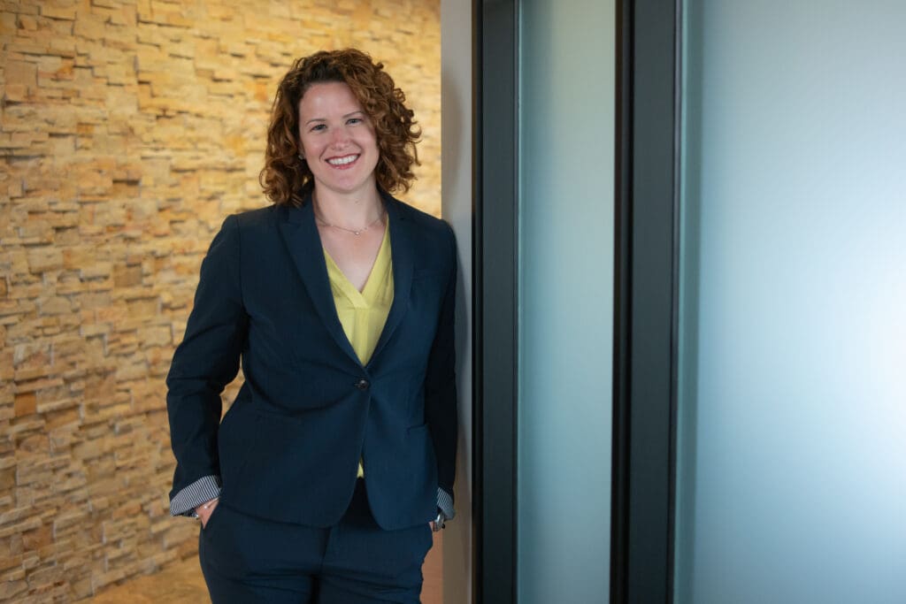 Woman standing in an office space.
